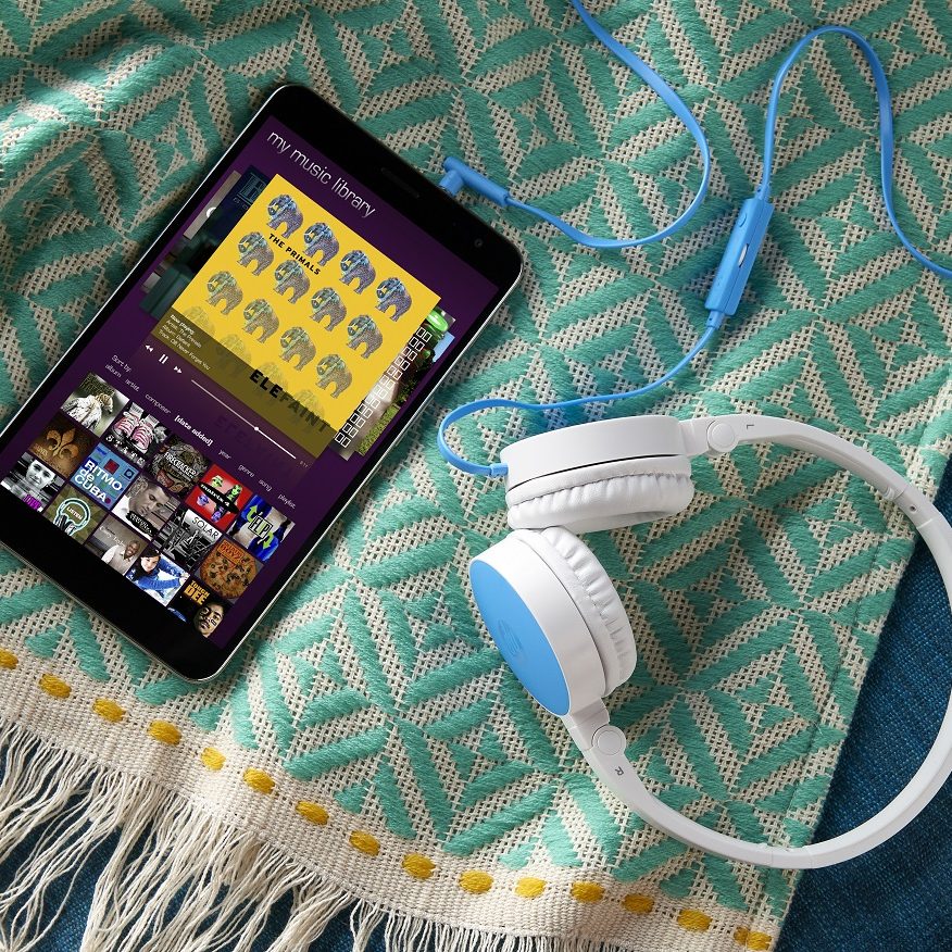 HP H2800 Headset (Blue) connected to tablet sitting on blanket